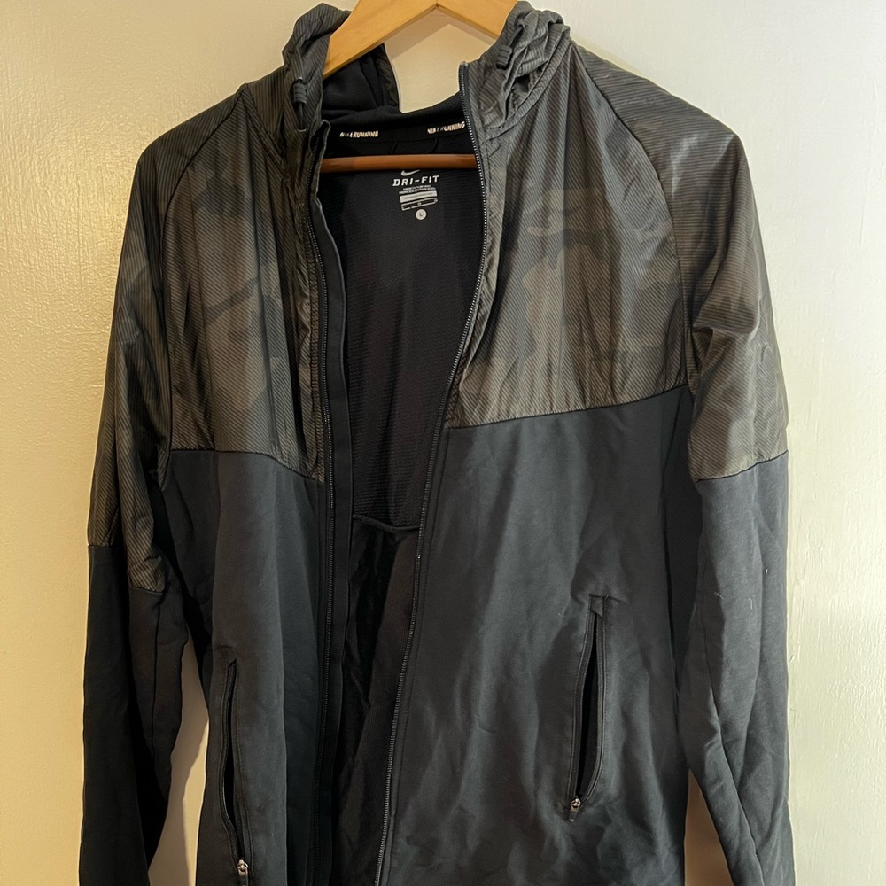 Nike Large camouflage Dri Fit hooded running jacket.